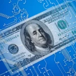 A $100 US bill with Benjamin Franklin's portrait is overlaid on a blue background featuring intricate white circuitry patterns, symbolizing the integration of technology and Coyyn, revolutionizing finance. | COYYN