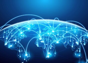 A digital illustration of a globe viewed from space, with illuminated lines and nodes connecting various points. The image represents global connectivity, the digital economy, and communication networks, with a blue and glowing visual aesthetic overlaid on a dark background. | COYYN