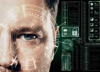 Close-up of a person's face with digital overlays, showcasing cutting-edge technology trends in biometric scanning. The interface includes holographic data like charts and graphs, suggesting a futuristic or security-related theme. The eye is prominently focused, embodying innovation at its core. | COYYN