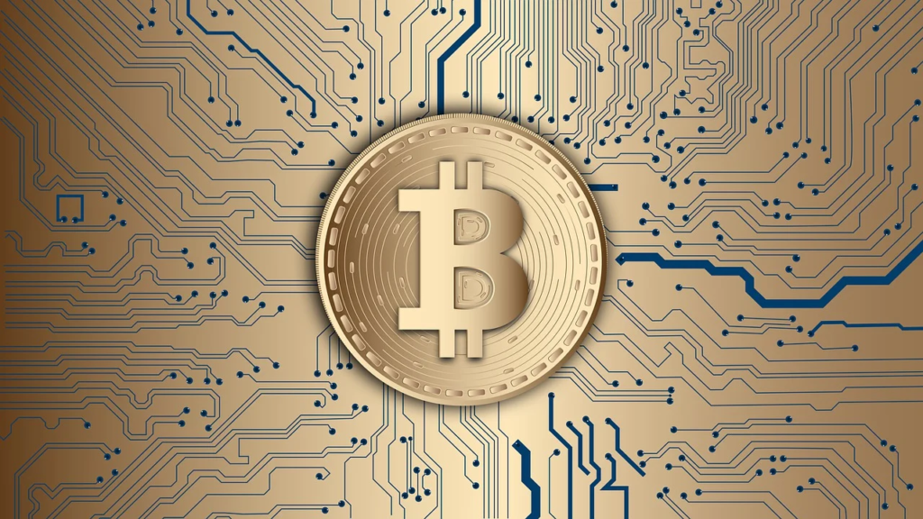 A digital gold coin with the Bitcoin symbol in the center is surrounded by a pattern of circuit lines on a gold background, representing cryptocurrency and blockchain technology. | COYYN