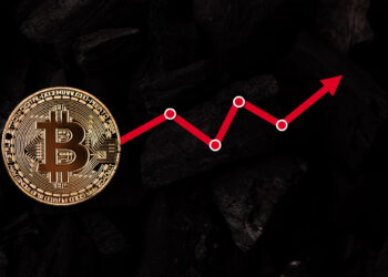A gold Bitcoin coin on a dark background with a red zigzag arrow pointing upward, symbolizing an increase in Bitcoin Price USD and overall cryptocurrency value. | COYYN