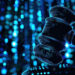 A digital illustration of a judge’s gavel composed of glowing blue dots, with a vibrant background of blue light and bokeh effects, symbolizing technology in law or digital justice. | COYYN