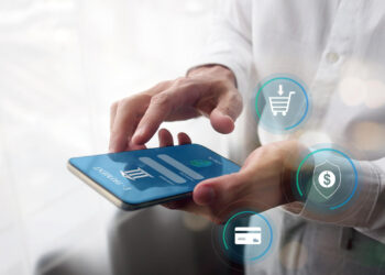 A person uses a smartphone for e-payment, with digital icons for shopping cart, security, and credit card floating nearby, symbolizing online shopping and secure transactions. | COYYN
