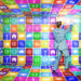 A man in a blue suit stands in a room covered floor to ceiling with colorful digital app icons, appearing to interact with icons on the wall. | COYYN